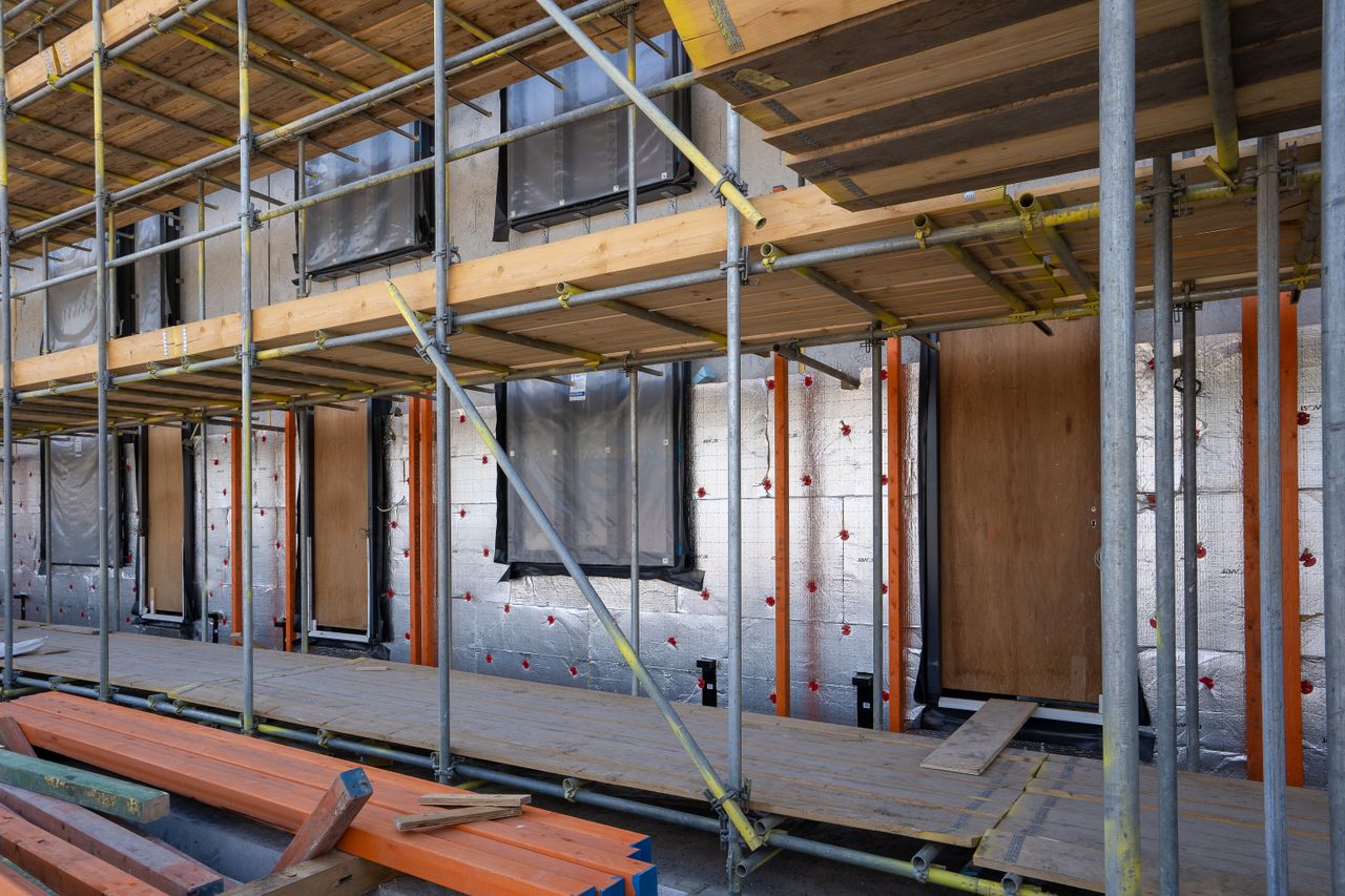 building-with-scaffolding-and-insulation